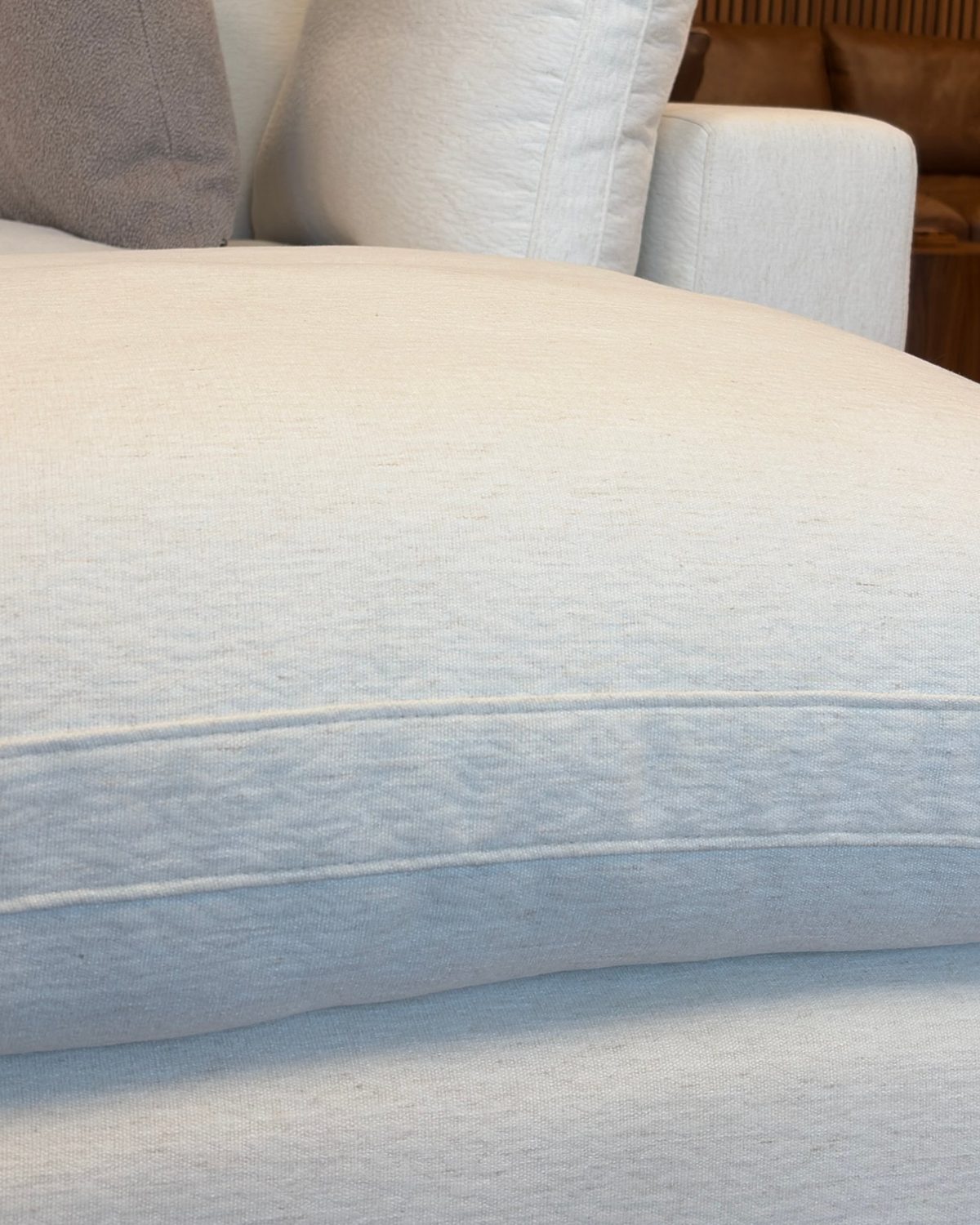 Close-up of an Aspen Cloud Petite seat cushion in Coastal Ivory linen