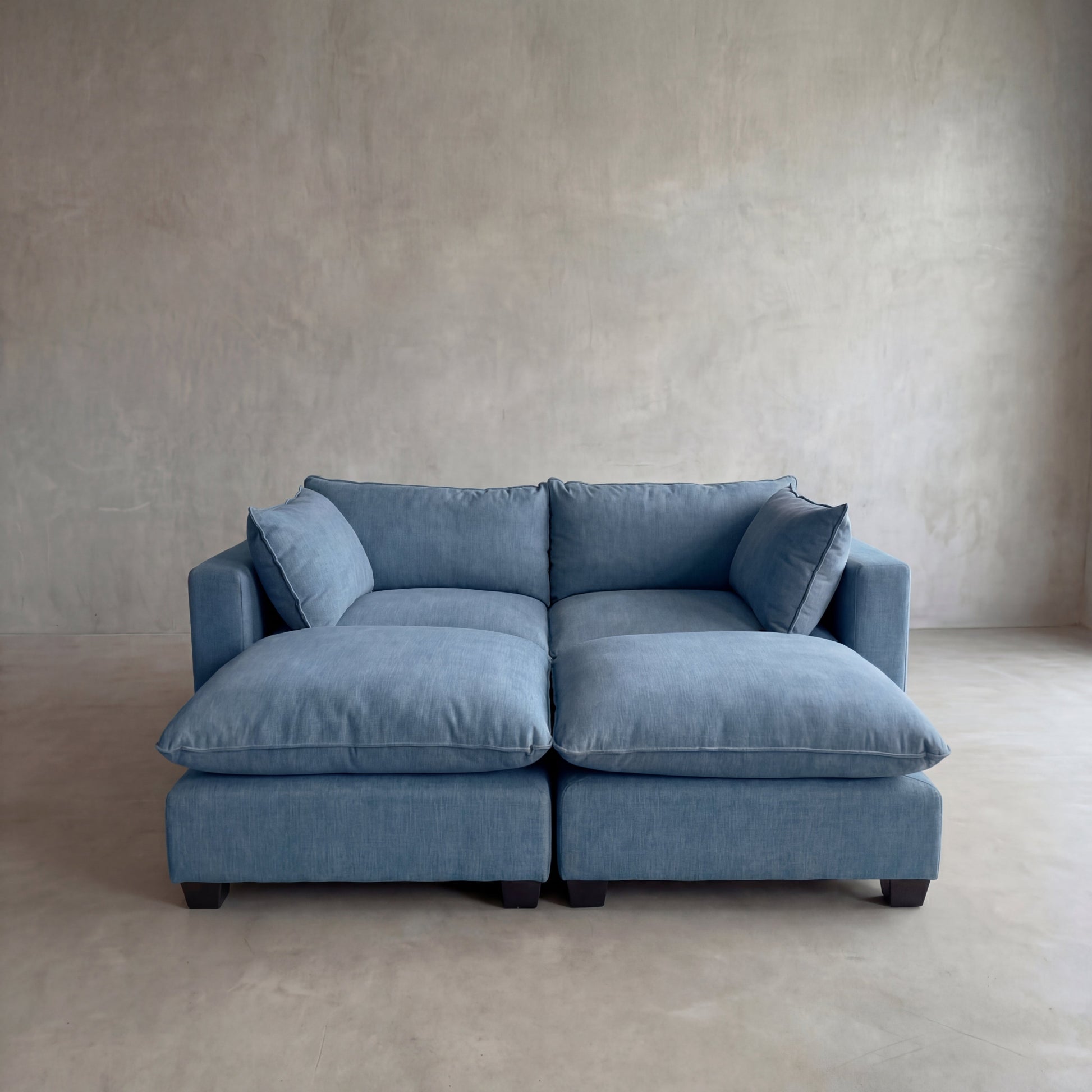 Blue modular sofa daybed in a minimalistic room