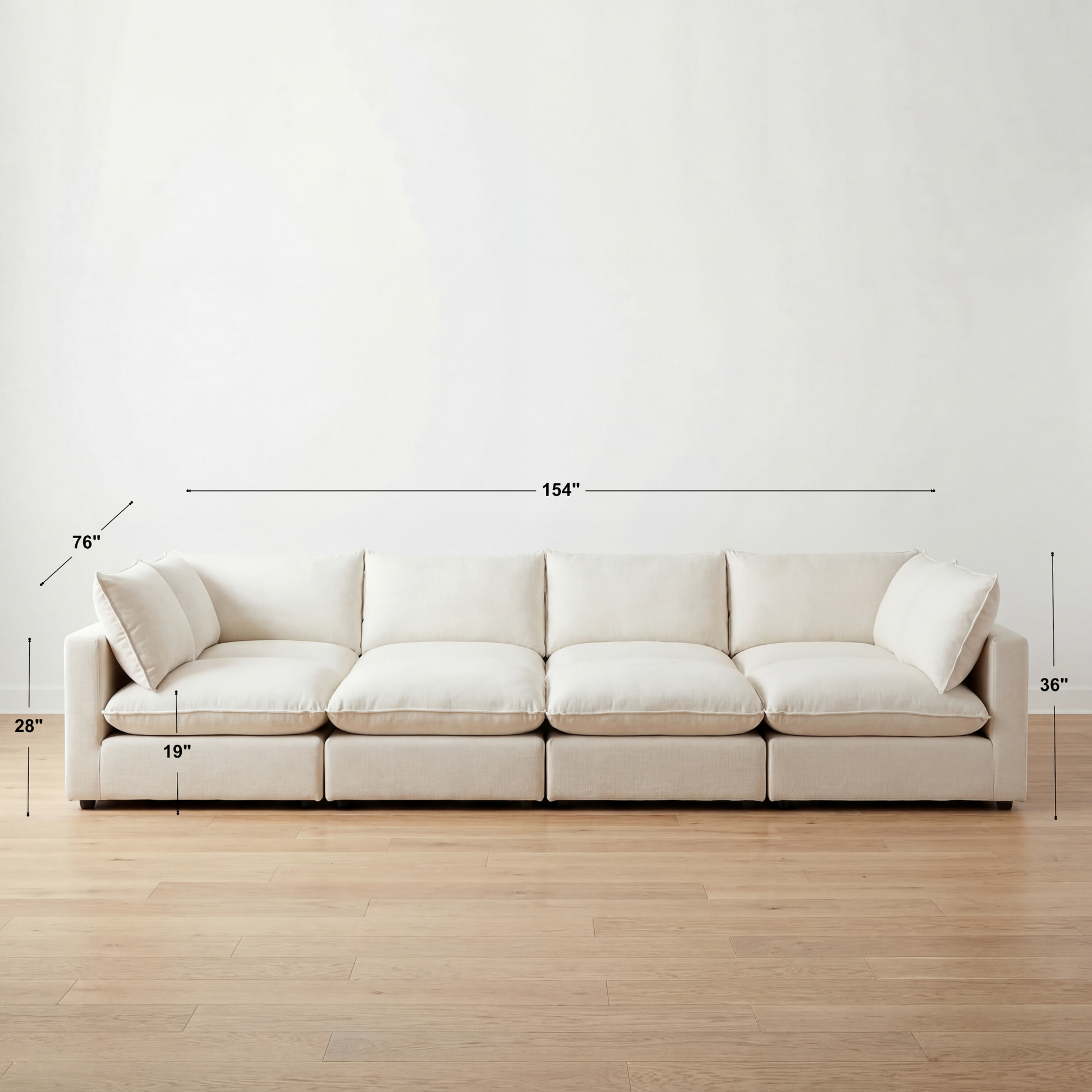 Beige sectional sofa with dimensions marked on a white wall and wooden floor.