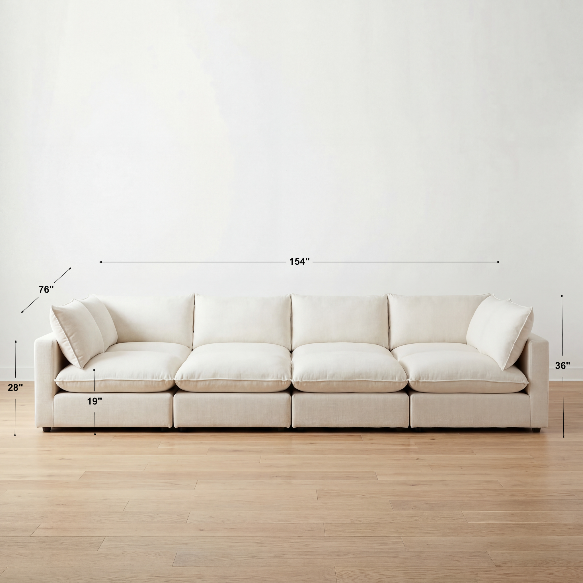Beige sectional sofa with dimensions marked on a white wall and wooden floor.