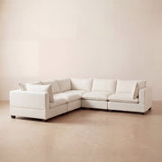 Alabaster modular L shape cloud sectional sofa in a modern room