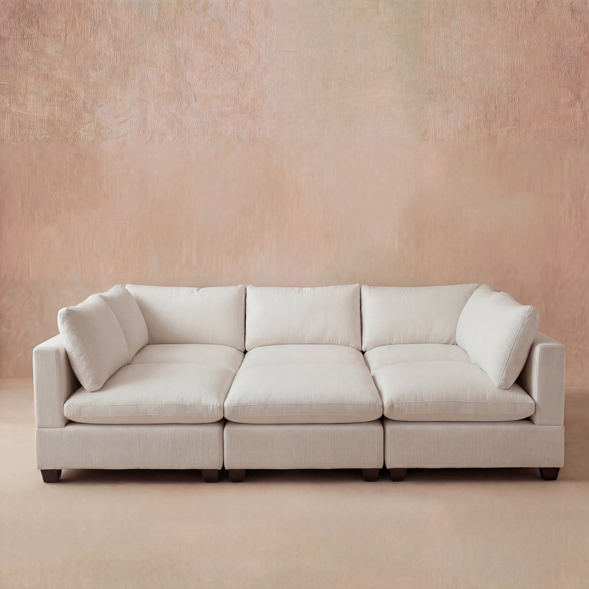 Coastal ivory cream pit sectional sofa wiht modular sections that can be re-arranged for various layouts