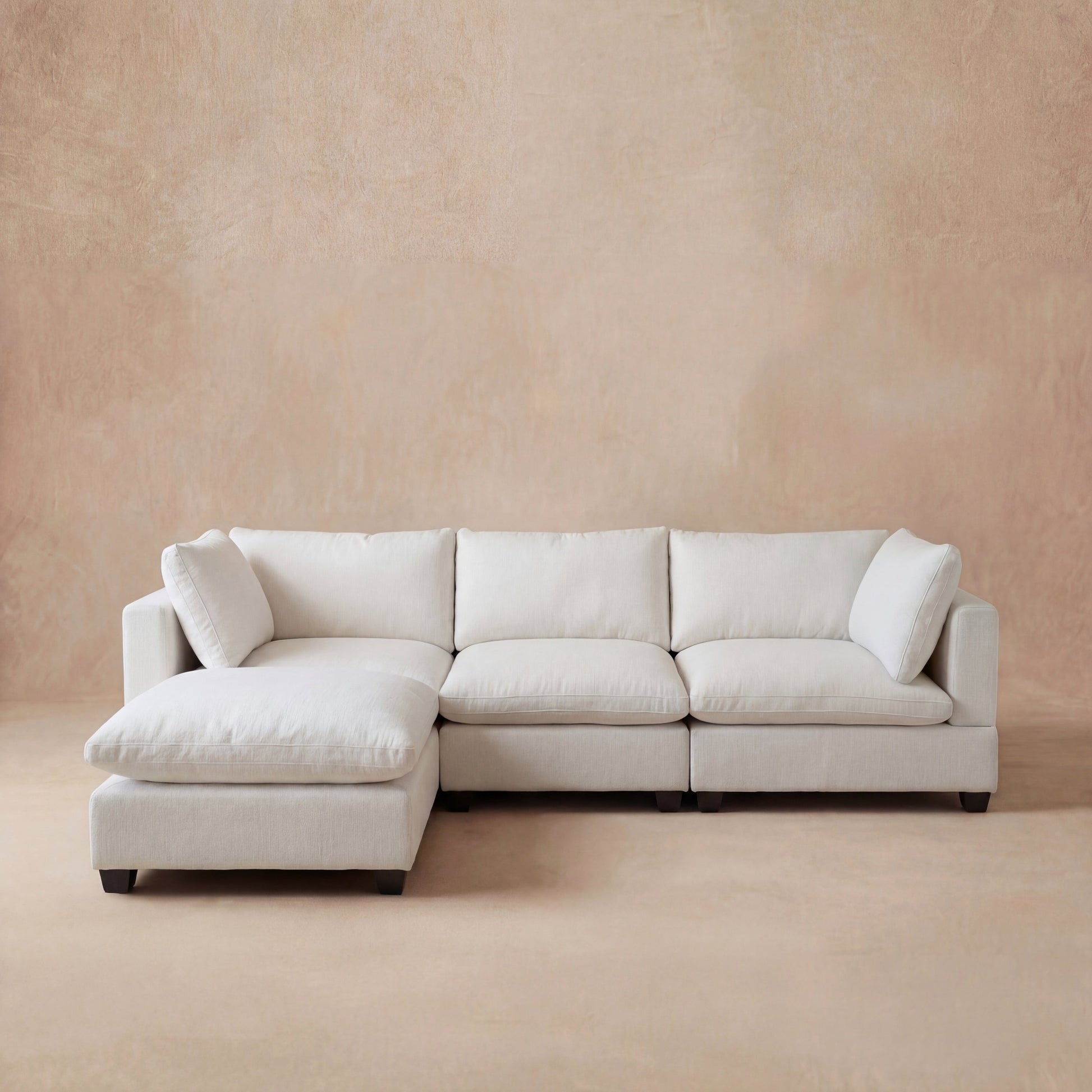 cream colored modular sectional sofa with the cloud couch design